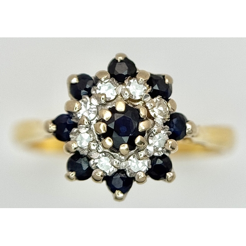527 - AN 18K YELLOW GOLD, DIAMOND AND SAPPHIRE SET CLUSTER RING. 3.3G, SIZE K. SC 4045