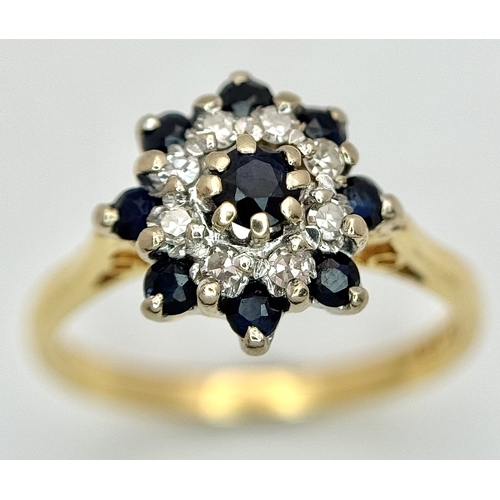 527 - AN 18K YELLOW GOLD, DIAMOND AND SAPPHIRE SET CLUSTER RING. 3.3G, SIZE K. SC 4045