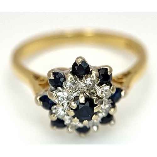 527 - AN 18K YELLOW GOLD, DIAMOND AND SAPPHIRE SET CLUSTER RING. 3.3G, SIZE K. SC 4045