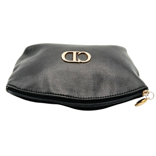 530 - A Christian Dior Black Leather Cosmetic Pouch. Black leather exterior with gold-tone hardware and to... 