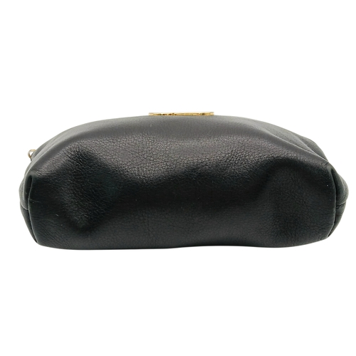 530 - A Christian Dior Black Leather Cosmetic Pouch. Black leather exterior with gold-tone hardware and to... 