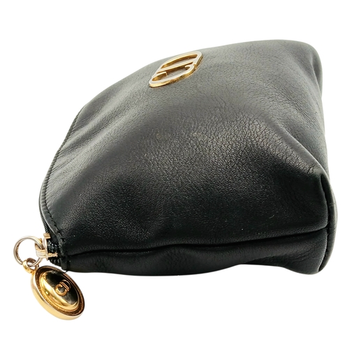 530 - A Christian Dior Black Leather Cosmetic Pouch. Black leather exterior with gold-tone hardware and to... 