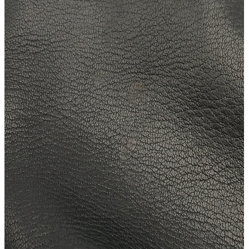 530 - A Christian Dior Black Leather Cosmetic Pouch. Black leather exterior with gold-tone hardware and to... 