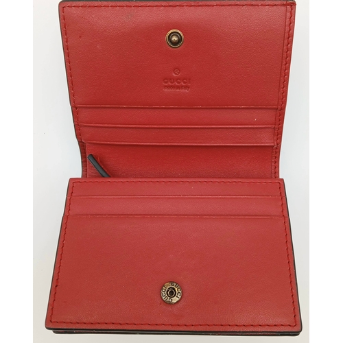 549 - A Gucci GG Supreme Cherry Card Holder Wallet. Ebony GG Supreme canvas exterior with gold-tone hardwa... 