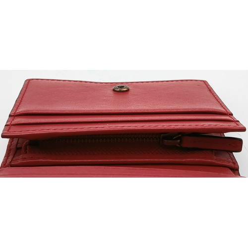 549 - A Gucci GG Supreme Cherry Card Holder Wallet. Ebony GG Supreme canvas exterior with gold-tone hardwa... 