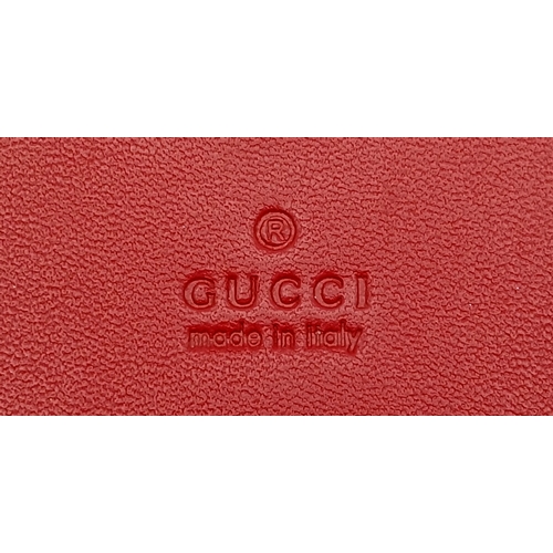 549 - A Gucci GG Supreme Cherry Card Holder Wallet. Ebony GG Supreme canvas exterior with gold-tone hardwa... 