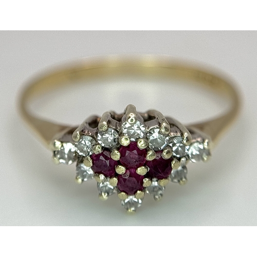 552 - A 9K YELLOW GOLD, DIAMOND AND RUBY RING. 1.5G, SIZE K. SC 4003
