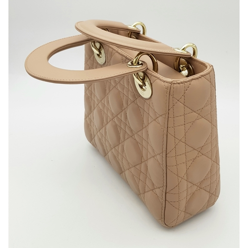 627 - A Lady Dior Pink Quilted Leather Top Handle Bag. Pink leather with dual rounded top handles, gold-to... 