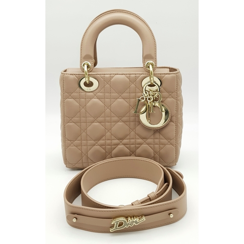 A Lady Dior Pink Quilted Leather Top Handle Bag. Pink leather with dual rounded top handles, gold-tone hardware, top flap opening, protected base studs and the iconic Dior letter charms. Pink suede-lined interior with a main compartment and a zipped pocket and a side pocket. Few signs of wear to the exterior but in very good condition overall. Approx 20cm length x 17cm height x 8cm depth. Comes with a detachable strap,  a dust cover, COA and care booklet. Please see photos or request a condition report.  STK026081