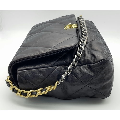 965 - A Chanel Black Quilted Leather Classic Flap Shoulder Bag. Black quilted leather exterior with gold-t... 