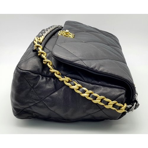 965 - A Chanel Black Quilted Leather Classic Flap Shoulder Bag. Black quilted leather exterior with gold-t... 