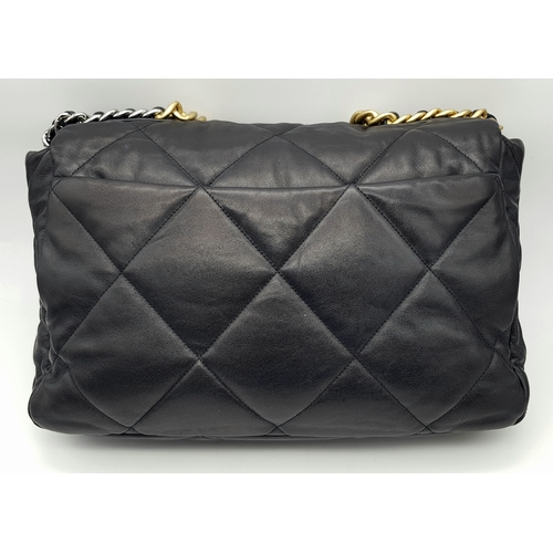 965 - A Chanel Black Quilted Leather Classic Flap Shoulder Bag. Black quilted leather exterior with gold-t... 
