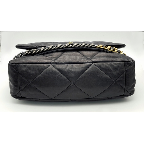 965 - A Chanel Black Quilted Leather Classic Flap Shoulder Bag. Black quilted leather exterior with gold-t... 
