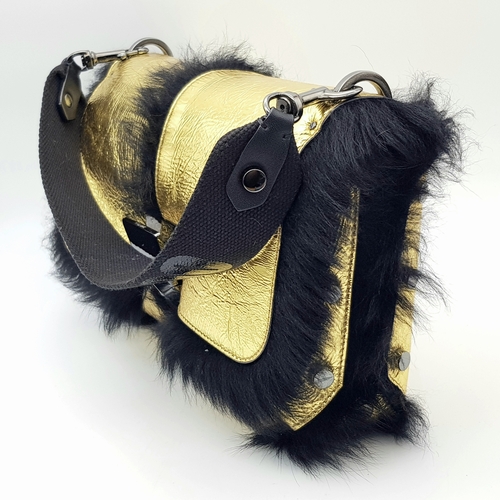 1006 - A Jimmy Choo Gold Metallic Textile and Black Fur Shoulder Bag. Gold metallic textile exterior with b... 