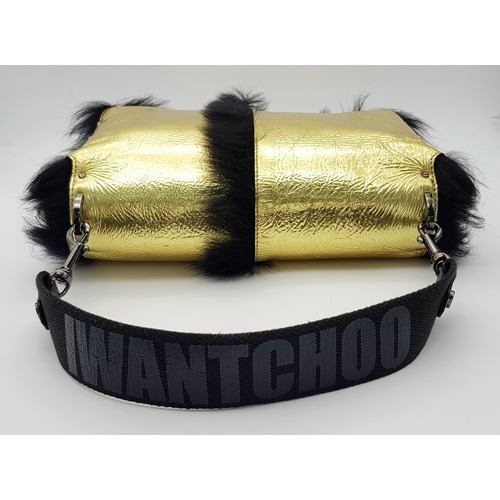 1006 - A Jimmy Choo Gold Metallic Textile and Black Fur Shoulder Bag. Gold metallic textile exterior with b... 