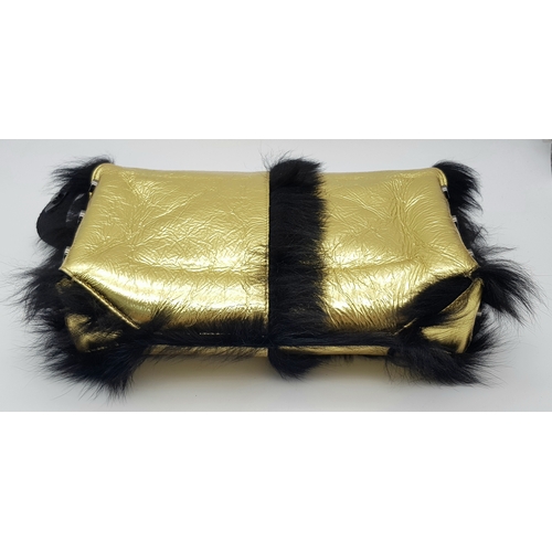 1006 - A Jimmy Choo Gold Metallic Textile and Black Fur Shoulder Bag. Gold metallic textile exterior with b... 