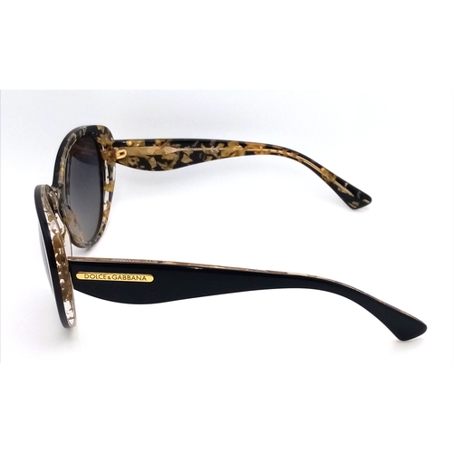 1013 - A Pair of Dolce and Gabbana Ladies Sunglasses. With pouch.    STK026390