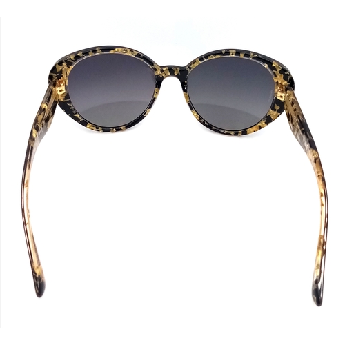 1013 - A Pair of Dolce and Gabbana Ladies Sunglasses. With pouch.    STK026390