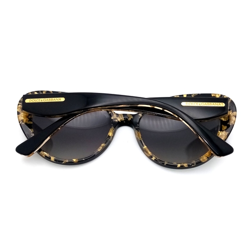 1013 - A Pair of Dolce and Gabbana Ladies Sunglasses. With pouch.    STK026390