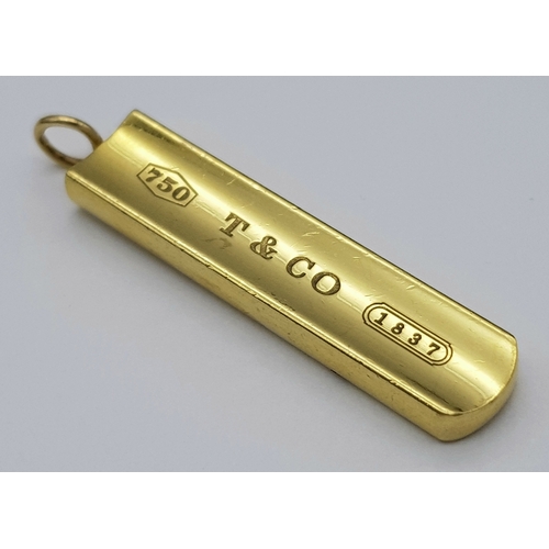 A TIFFANY AND CO, 18K YELLOW GOLD, INGOT PENDANT. FULL TIFFANY HALLMARKED. HAS A SLIGHT CHIP OUT OF THE EDGE AT THE BACK. NOT NOTICABLE WHEN WORN.  13G. TAN 3012