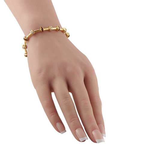 1045 - A Charles Krypell 18K Yellow Gold 1.0ct Diamond and Ruby Bracelet. Featuring 1.0 carats of Diamonds ... 