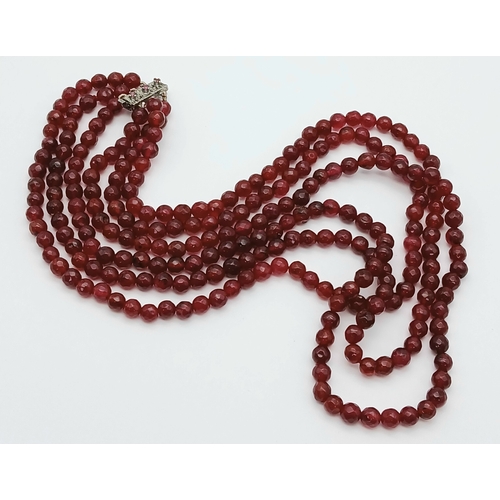 1032 - A Three Row Garnet Necklace with Silver Clasp. 44-46cm. ML20