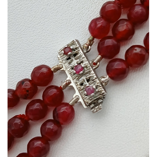 1032 - A Three Row Garnet Necklace with Silver Clasp. 44-46cm. ML20