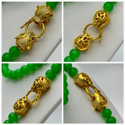 1039 - A Matinee Length Green Agate Bead Necklace with Gilded Twin Panther Clasp. 78cm. ML13.