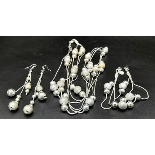 508 - An Italian Sterling Silver Set of Necklace, Bracelet and Pair of Drop Earrings. Bauble decoration th... 