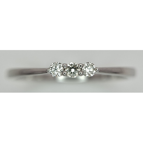 558 - AN 18K WHITE GOLD, DIAMOND 3 STONE RING. 1.3G, SIZE N. SC 4048