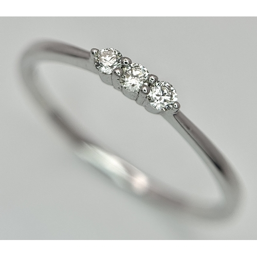 558 - AN 18K WHITE GOLD, DIAMOND 3 STONE RING. 1.3G, SIZE N. SC 4048