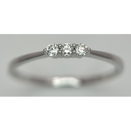 558 - AN 18K WHITE GOLD, DIAMOND 3 STONE RING. 1.3G, SIZE N. SC 4048