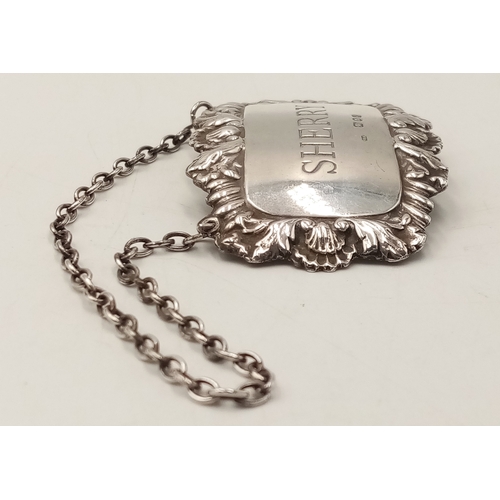 518 - Hallmarked Vintage SILVER DECANTER LABEL for ‘SHERRY’. Having attractive ornate surround with Shell ... 