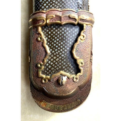 875 - A Late Shin-Shinto Japanese Sword and leather scabbard cover. A late Shin-shinto katana signed Kashu... 