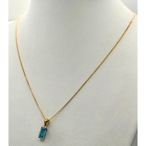 557 - A Stylish 9 Carat Gold Blue Topaz Set Pendant Necklace, 41cm Length Chain. Pendant measures 1.4cm Dr... 