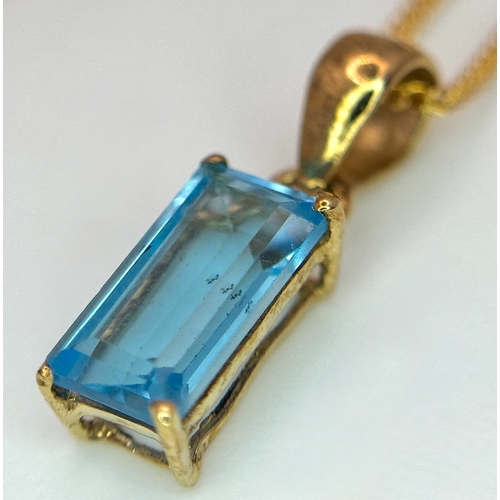 557 - A Stylish 9 Carat Gold Blue Topaz Set Pendant Necklace, 41cm Length Chain. Pendant measures 1.4cm Dr... 