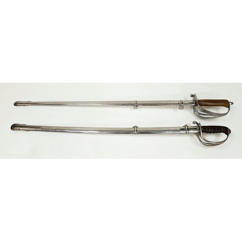 854 - Two Vintage British Army Swords with Metal Scabbards. Broad arrow (India) mark on shorter sword and ... 