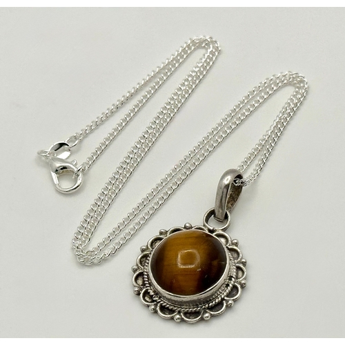1000 - A Vintage Sterling Silver and Tigers Eye Pendant on a later Sterling Silver 46cm Length Chain. Penda... 