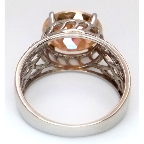 1014 - An Attractive Sterling Silver Twilight Fire Topaz Open Work Design Ring Size O, set with a 1.2cm Lon... 