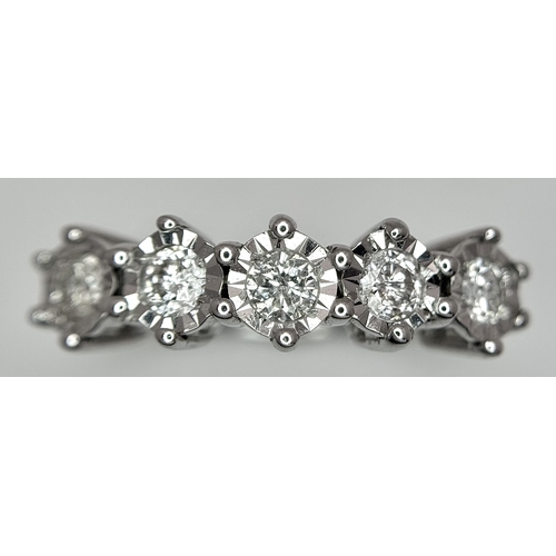 1012 - A 9K White Gold Five Stone Diamond Ring. Size O. 2.7g. NL16/11206.