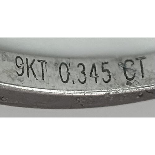 1012 - A 9K White Gold Five Stone Diamond Ring. Size O. 2.7g. NL16/11206.