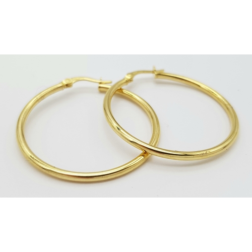 1019 - A Pair of 9K Yellow Gold Hoop Earrings. 3cm diameter. 1.3g.
