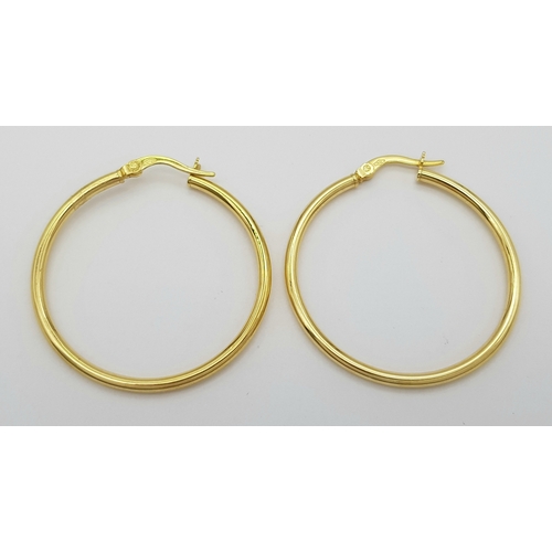 1019 - A Pair of 9K Yellow Gold Hoop Earrings. 3cm diameter. 1.3g.