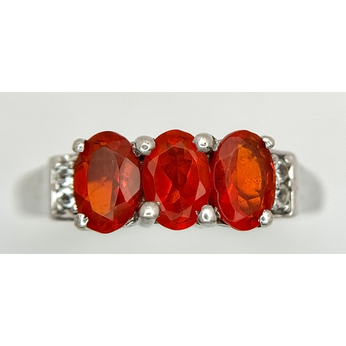 1009 - A Pretty Sterling Silver Fire Opal and White Sapphire Ring Size P1/2, set with Three 6mm Oval Cut Fi... 