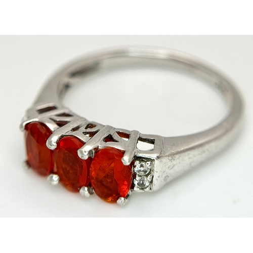 1009 - A Pretty Sterling Silver Fire Opal and White Sapphire Ring Size P1/2, set with Three 6mm Oval Cut Fi... 