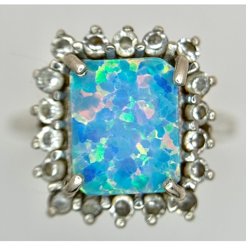 1023 - A Vintage Sterling Silver Opal and White Quartz Ring Size R, set with a 1cm Long Rectangle Cut Opal ... 
