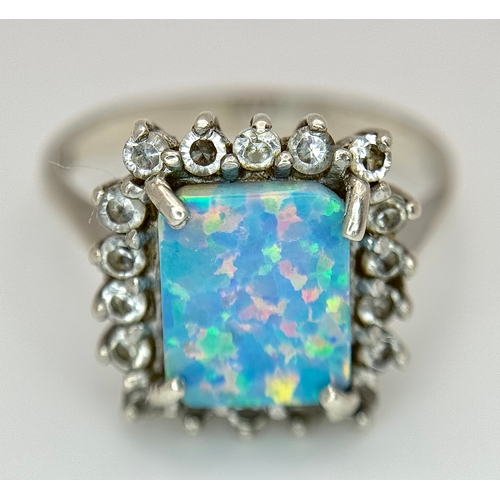 1023 - A Vintage Sterling Silver Opal and White Quartz Ring Size R, set with a 1cm Long Rectangle Cut Opal ... 