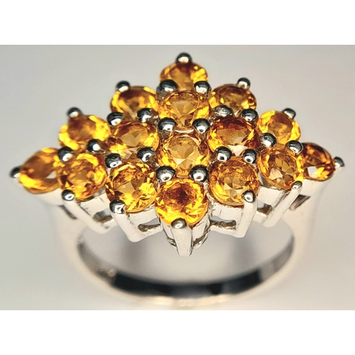 1055 - An Attractive Sterling Silver Citrine Set Cluster Ring Size N, measures 2.5cm Long at the crown. Set... 