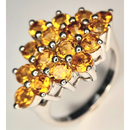 1055 - An Attractive Sterling Silver Citrine Set Cluster Ring Size N, measures 2.5cm Long at the crown. Set... 