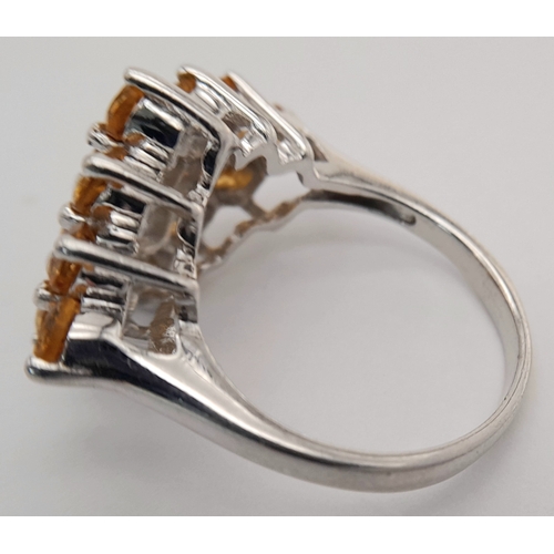 1055 - An Attractive Sterling Silver Citrine Set Cluster Ring Size N, measures 2.5cm Long at the crown. Set... 